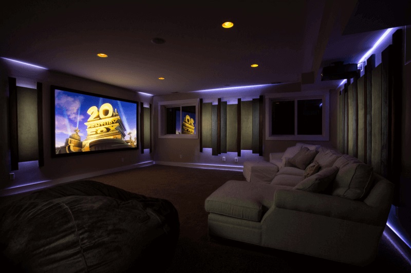 Image of a large media room area with 20th Century Fox logo being displayed on the screen