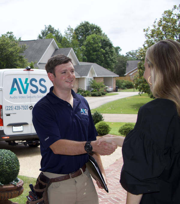 AVSS professional greeting a client in front of her home
