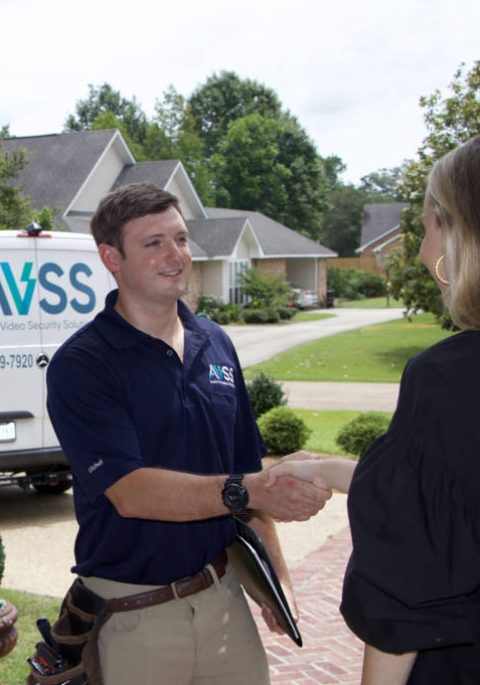 AVSS professional greeting a client in front of her home